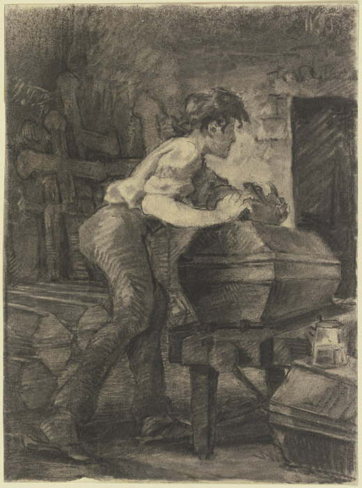Ein junger Schreiner hobelt in der Werkstatt an einem Sarg od Wilhelm Trübner