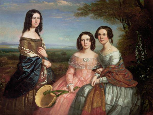 Group portrait of three girls in a landscape